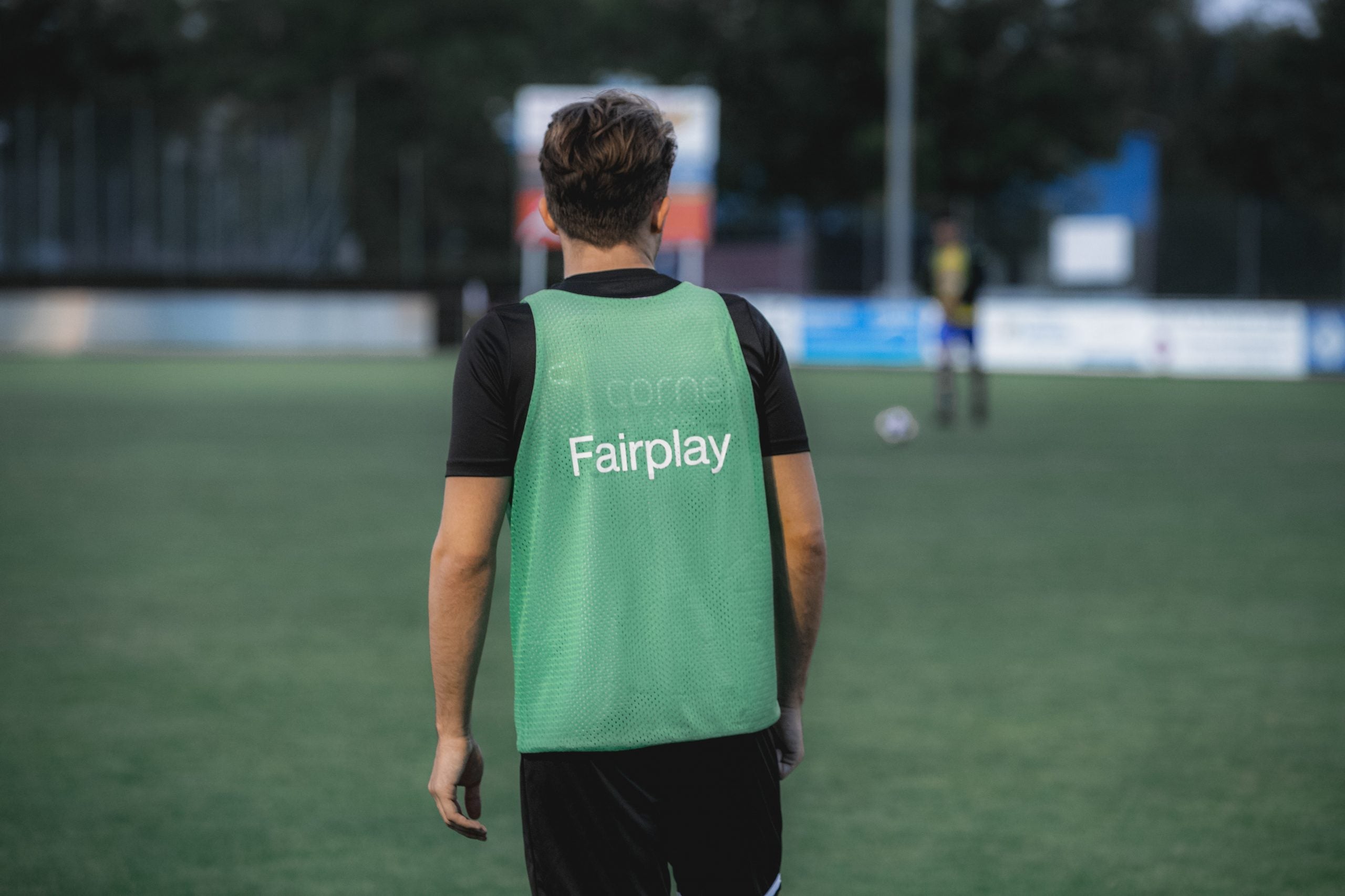 Image of team player in football shirt and bib