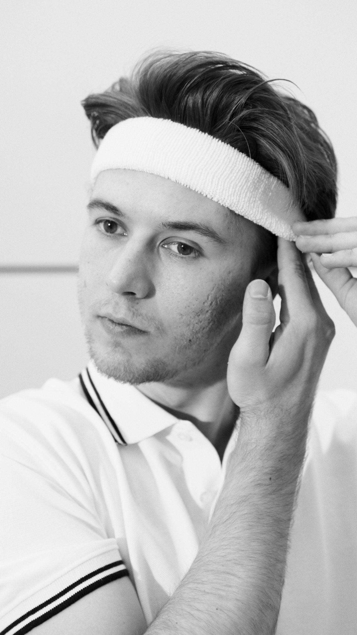 Man putting on gym head band