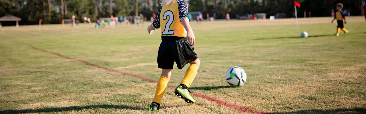 Child playing football