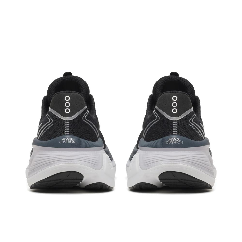 A pair of Saucony Hurricane 26 Womens Running Shoes - Black/Silver shown from the back, featuring a chunky white midsole and the text 'MAX CUSHION' printed on the heel.